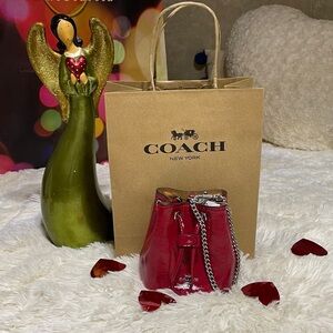 Coach Drawstring Wristlet Pouch Bag in red patent leather with silver hardware